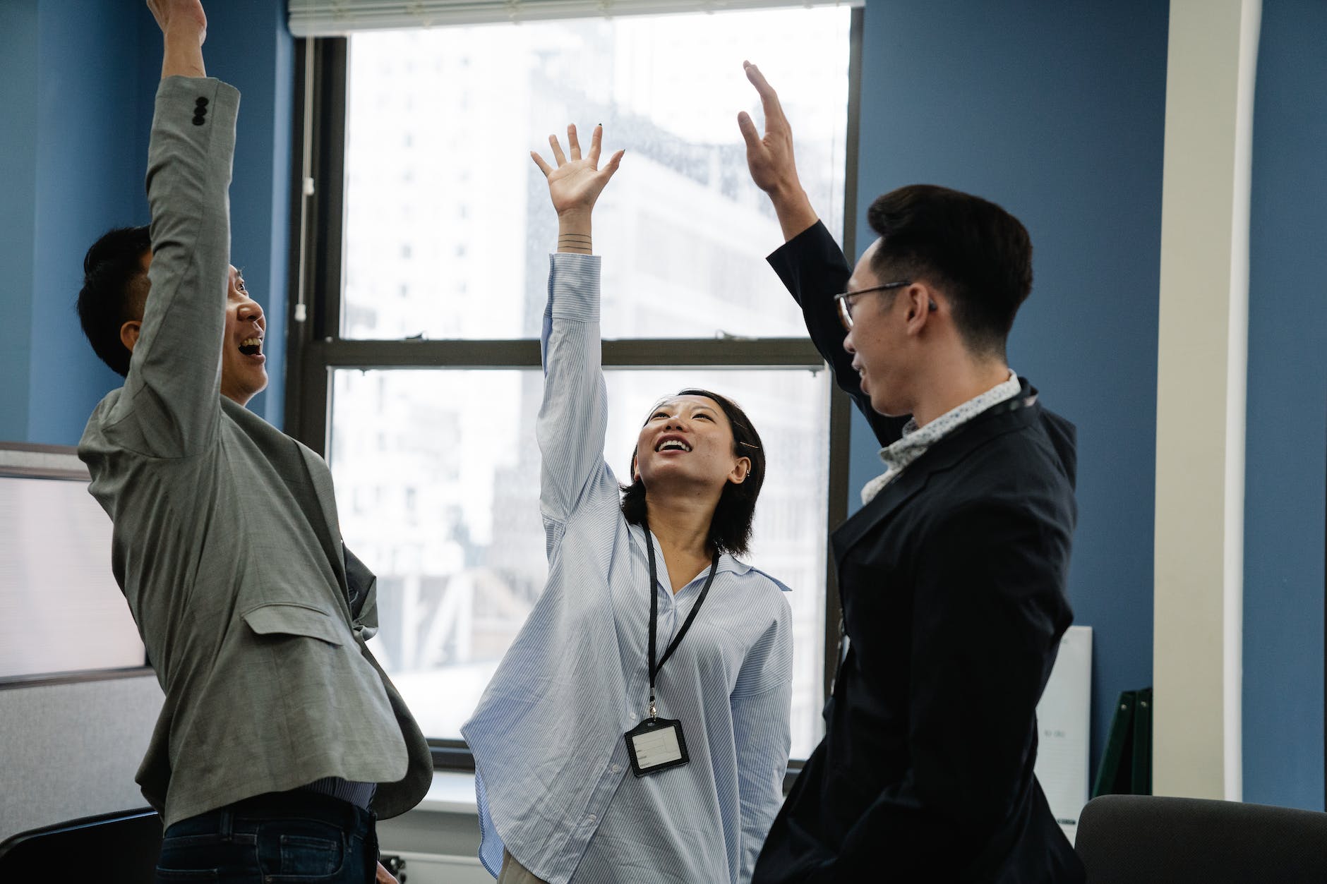 coworkers cheering in the office